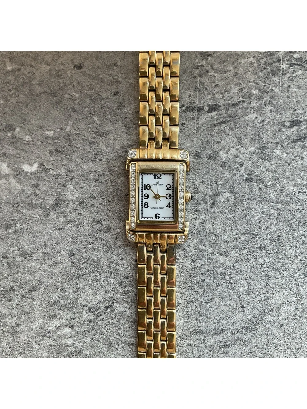 Anne Klein Womens Tank Style Watch 25mm Gold Tone Case & Band MOP Dial Bin O
